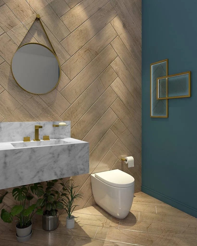 Dourado na decoração em misturador de mesa, saboneteira de parede e papeleira